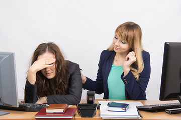 Image showing The girl in the office soothes the dismissed colleague