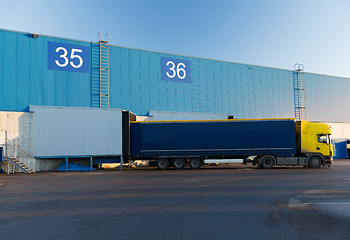 Image showing warehouse gates and truck loading