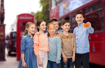 Image showing kids talking selfie by smartphone over london city