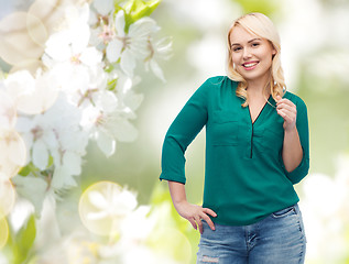 Image showing smiling young woman in shirt and jeans