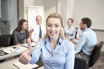 Image showing group of smiling businesspeople meeting in office