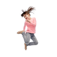 Image showing happy little girl jumping in air