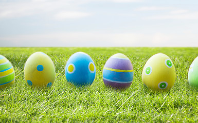 Image showing close up of colored easter eggs on wooden surface