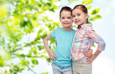 Image showing happy smiling little girls hugging