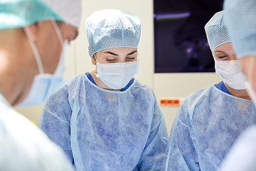 Image showing group of surgeons in operating room at hospital