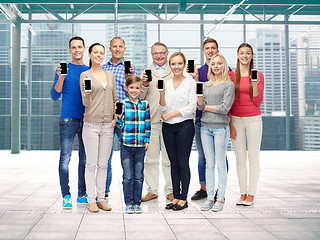Image showing group of smiling people with smartphones