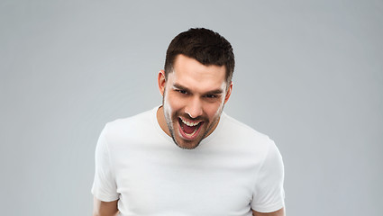 Image showing angry man over gray background