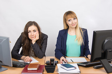 Image showing Two girls looking to frame a joy, and the second upset