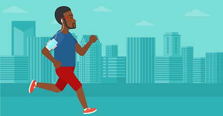 Image showing Man jogging with earphones and smartphone.