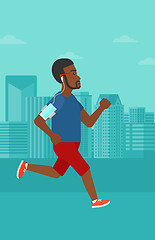 Image showing Man jogging with earphones and smartphone.