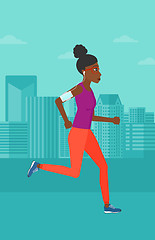 Image showing Woman jogging with earphones and smartphone.