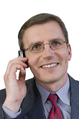 Image showing Smiling businessman with cell phone