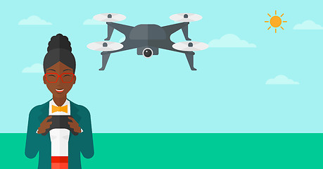 Image showing Woman flying drone.