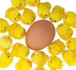 Image showing Easter chicks surrounding a large egg