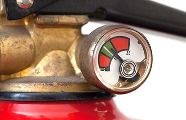 Image showing Dusty fire extinguisher fully charged, selective focus