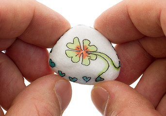 Image showing Stone with drawing of a clover four and small hearts