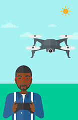 Image showing Man flying drone.