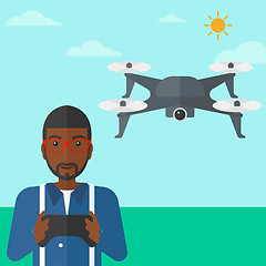 Image showing Man flying drone.