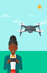 Image showing Woman flying drone.