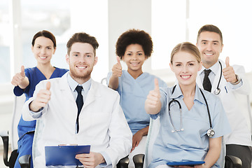 Image showing group of happy doctors on seminar at hospital