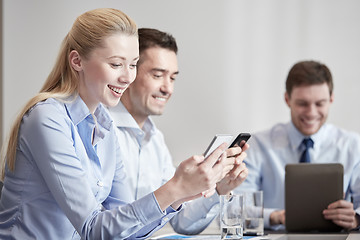 Image showing businesspeople with smartphones and tablet pc