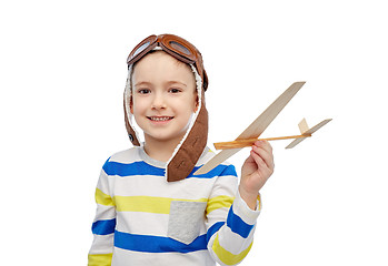 Image showing happy little boy in aviator hat with airplane