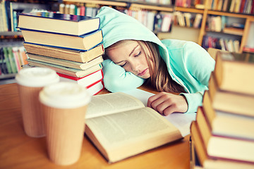 Image showing student or woman with books sleeping in library