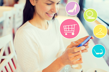 Image showing smiling woman with smartphone shopping online