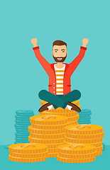 Image showing  Happy businessman sitting on coins.