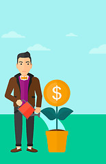 Image showing Man watering money flower.