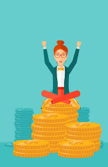 Image showing  Happy business woman sitting on coins.