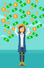 Image showing Happy woman with  flying money. 