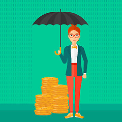 Image showing Woman with umbrella protecting money.