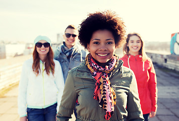 Image showing group of happy teenage friends on city street