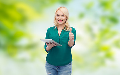 Image showing smiling woman with tablet pc showing thumbs up