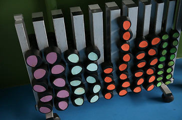 Image showing close up of dumbbells and sports equipment in gym