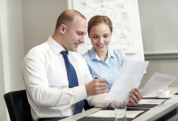 Image showing business people with papers meeting in office