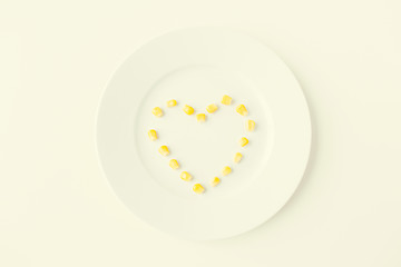 Image showing close up of plate with corn  in heart shape 