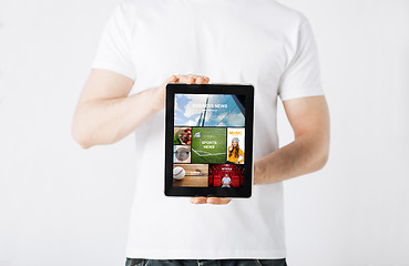 Image showing close up of man with tablet pc and web pages