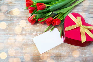 Image showing close up of red tulips, letter and chocolate box