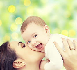 Image showing happy mother with baby over green background