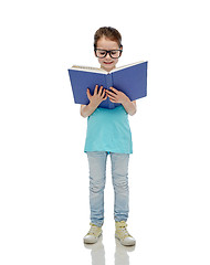 Image showing happy little girl in eyeglasses reading book