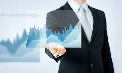 Image showing close up of man hand showing diagram chart
