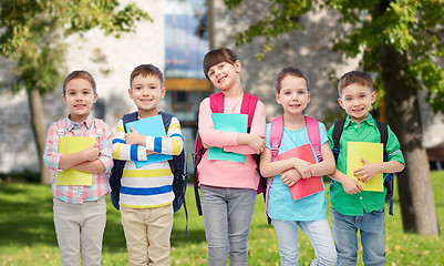 Image showing happy children with school bags and notebooks