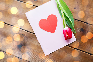 Image showing close up of flowers and greeting card with heart