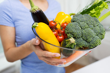 Image showing close up of woman holding vegetables in bowl