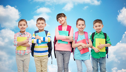 Image showing happy children with school bags and notebooks