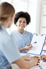 Image showing group of happy doctors meeting at hospital office