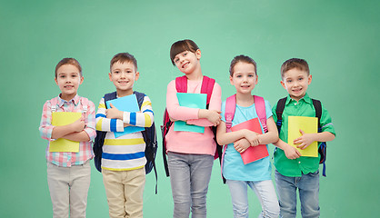 Image showing happy children with school bags and notebooks