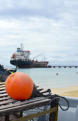 Image showing oil tanker ship at dock with lobster pot trap and buoy  Picnic C